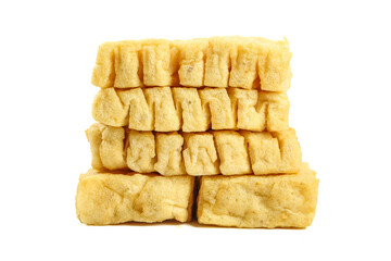 Fresh Golden Fried Tofu Cubes Arranged in Rows on White Background