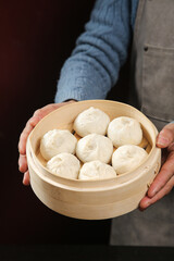 Fresh Xiaolongbao Soup Dumplings with Meat in Bamboo Steamer - Traditional Shengzhou Chinese Dim Sum Buns