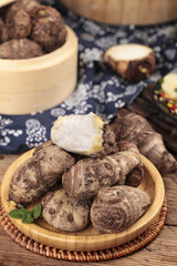 Fresh Taro Roots in Bamboo Bowls - Traditional Asian Cooking Ingredient from Shandong China