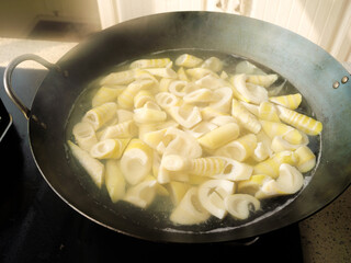 Fresh Bamboo Shoots Boiling in Wok - Traditional Asian Cooking Preparation