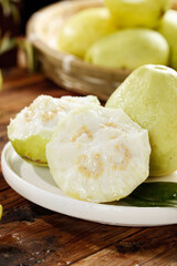 Fresh Sliced Guava Fruit with Cream Flesh on White Plate - Tropical Healthy Snack Food Photography