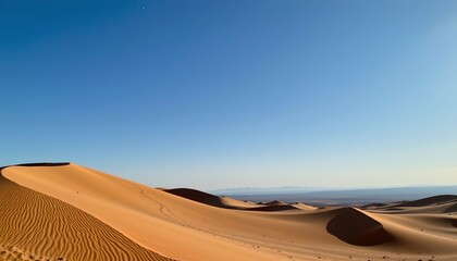Serene Reddish Sand Dune Under Sunlit Sky