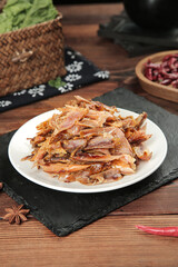 Homemade Salt Baked Chicken Jerky with Flavored Seasoning on Rustic Wooden Table