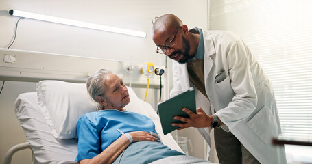 Fototapeta premium Hospital, old woman and doctor with tablet, checkup and diagnosis with healthcare. Consultation, medical service or elderly person in clinic, physician or tech for results, appointment or examination