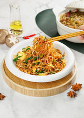 Homemade Fried Vermicelli Noodles with Mixed Vegetables and Sweet Potato in White Bowl