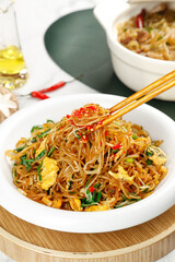 Asian Stir-Fried Vermicelli Noodles with Vegetables and Egg in White Bowl