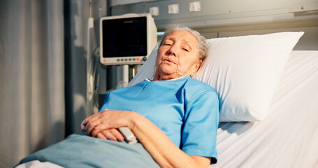 Obraz premium Rest, woman and senior patient in hospital for recovery of surgery, diagnosis or treatment. Sick, relax and elderly female person in bed for medical consultation or appointment in ward at clinic.