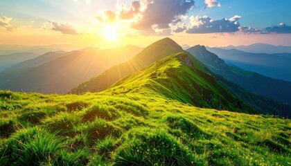 Grassy mountain ridge under a bright sun, with peaks fading into the distance beneath a partially cloudy blue sky