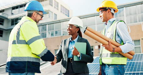 Happy people, engineer and handshake with team for solar power project, maintenance or deal in city. Group, technician or employees shaking hands with smile for sustainable plan or renewable energy