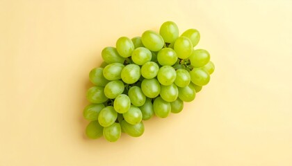 Lush green grapes display a vibrant freshness against a soft, neutral background tone.