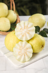 Fresh White Guava Fruit Slices Showing Creamy Heart-Shaped Flesh Pattern on Marble Surface