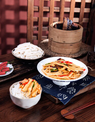 Fried Bamboo Shoots with Bacon - Traditional Chinese Cuisine on White Plate
