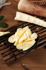 Fresh Bamboo Shoots Sliced on Traditional Bamboo Mat - Asian Cooking Ingredient