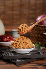 Japanese Natto Fermented Soybeans in Bowl with Wooden Spoon Traditional Asian Food