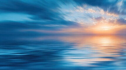 Obraz premium A serene landscape depicting a vibrant sunset over calm waters, with the sky filled with dynamic clouds reflecting on a tranquil sea