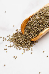 Organic Millet Grains in Wooden Scoop - Healthy Gluten-Free Cereal on White Background