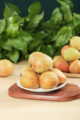 Fresh Guava Fruits on Wooden Board with Green Leaves - Tropical Produce Display