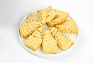 Sliced Dried Tofu on White Plate - Asian Vegetarian Protein Ingredient