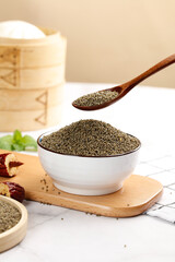 Organic Millet Grains in Bowl with Wooden Spoon - Healthy Natural Superfood Ingredient