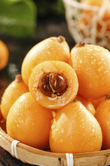 Fresh Loquat Fruits from Panzhihua - Golden Asian Stone Fruit in Woven Basket Display