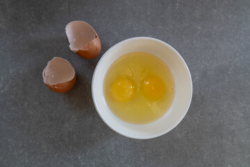 cracked eggs in bowl 