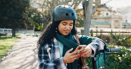 Notification, communication and woman in park with phone, digital and social media on internet. Happiness, online and African person on bicycle with smile, scrolling and reading for entertainment