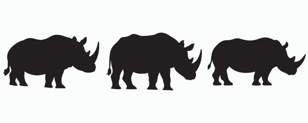 Silhouettes of rhinoceroses in different stances, isolated on white background. Vector illustration for wildlife, safari, and animal conservation themes.