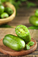 Fresh Mini Kiwi Fruits on Wooden Board - Healthy Organic Snack Food