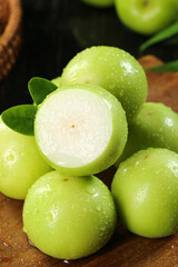 Fresh Taiwan Green Jujube Fruits with Water Droplets on Wooden Background