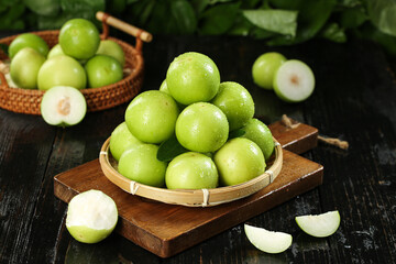 Fresh Green Jujube Dates in Bamboo Bowls - Traditional Asian Winter Fruit Harvest