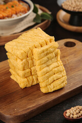 Fresh Yellow Tofu Curd Slices on Wooden Board Asian Cooking Ingredients Studio Photography