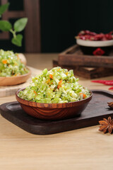 Fresh Sauerkraut Salad in Wooden Bowl - Healthy Fermented Vegetable Appetizer on Rustic Kitchen Table