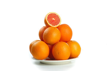 Fresh Blood Oranges on White Plate with Cut Half Showing Red Interior