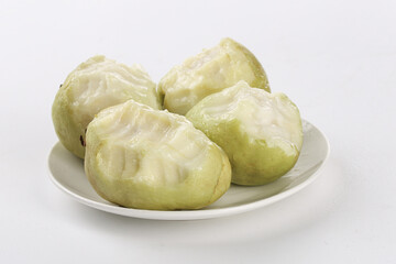 Fresh Guava Fruits on White Plate with Soft Cream Background