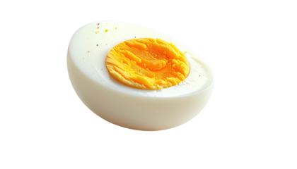Half of a boiled egg, sliced, showing the white and yolk.  The yolk is a rich, golden color.  A few specks of seasoning are visible