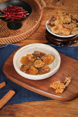 Dried Shiitake Mushrooms and Chinese Cooking Ingredients on Wooden Table