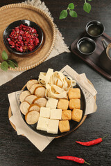 Asian Hot Pot Ingredients with Tofu and Soy Products on Wooden Platter
