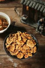 Dried Specialty Mushrooms in Rustic Bowl - Gourmet Cooking Ingredients on Wooden Table