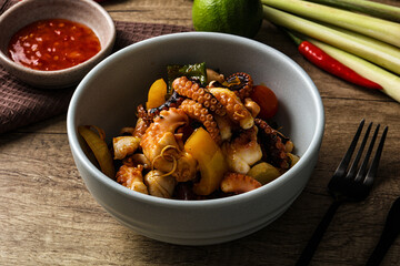 Roasted octopus with vegetables and oil