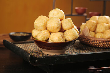 Fresh Golden Tofu Puffs in Traditional Ceramic Bowls - Asian Cuisine Ingredients for Homemade Cooking