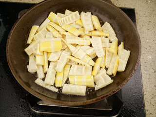 Fresh Bamboo Shoots Cooking in Pan - Traditional Asian Vegetable Preparation
