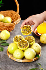 Fresh Passion Fruit with Golden Pulp and Seeds on Bamboo Plate - Tropical Exotic Fruit Display