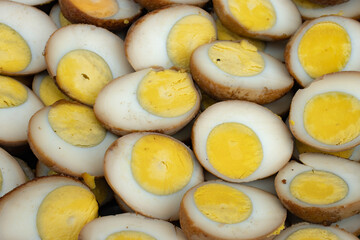 Peel the boiled eggs and cut them in half, so that the yolk and white are clearly visible.