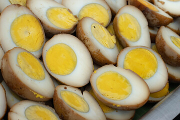 Peel the boiled eggs and cut them in half, so that the yolk and white are clearly visible.