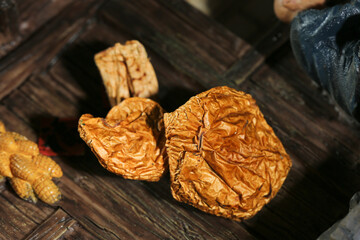 Authentic Dried Shiitake Mushrooms on Wooden Surface - Traditional Northeastern Asian Cooking Ingredients