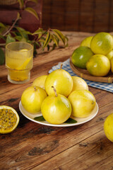 Fresh Golden Passion Fruits from Hainan China with Tropical Juice on Rustic Wooden Table