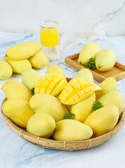 Fresh Golden Vietnamese Mangoes in Bamboo Basket with Juice - Tropical Fruit Display