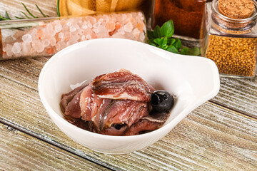 Canned anchovy with oil in the bowl