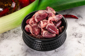 Raw chicken hearts in the bowl
