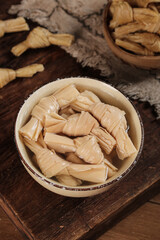 Fresh Bamboo Shoots in Ceramic Bowl on Rustic Wooden Table - Traditional Asian Preserved Vegetable